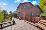 This stunning property boasts a beautiful wooden deck perfect for outdoor entertaining.