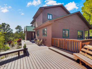 This stunning property boasts a beautiful wooden deck perfect for outdoor entertaining.