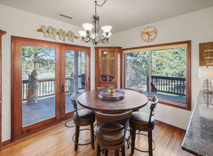 This stunning dining area boasts a warm and inviting atmosphere, perfect for family gatherings.