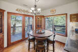 This stunning dining area boasts a warm and inviting atmosphere, perfect for family gatherings.