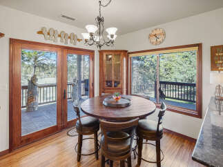 This stunning dining area boasts a warm and inviting atmosphere, perfect for family gatherings.