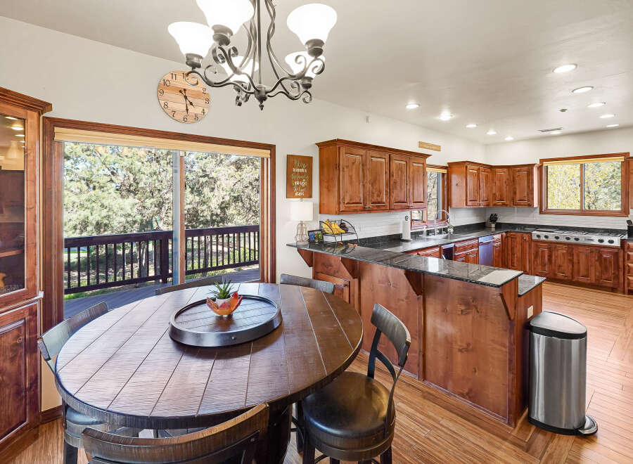 This stunning kitchen boasts a seamless blend of rustic charm and modern convenience.