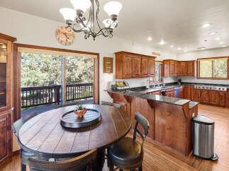 This stunning kitchen boasts a seamless blend of rustic charm and modern convenience.