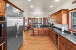 This stunning kitchen boasts custom cabinetry, granite countertops, and stainless steel appliances.
