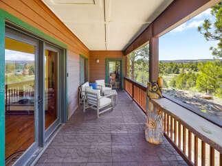 Enjoy breathtaking views from this stunning property's expansive deck.