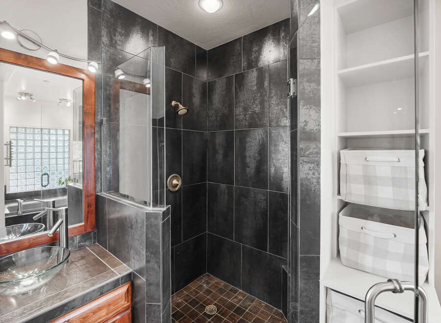 Step into luxury with this stunning bathroom featuring a modern shower design.