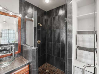 Step into luxury with this stunning bathroom featuring a modern shower design.
