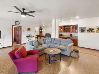 Step into luxury with this stunning property featuring a spacious living area, perfect for entertaining.