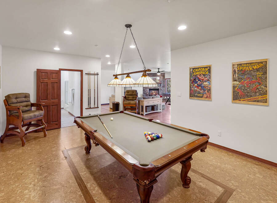 Step into luxury with this stunning property featuring a dedicated game room, perfect for entertaining.