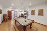 Step into luxury with this stunning property featuring a dedicated game room, perfect for entertaining.
