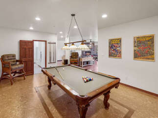 Step into luxury with this stunning property featuring a dedicated game room, perfect for entertaining.