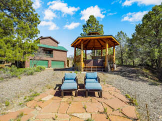 Escape to your own private oasis with this stunning property! Featuring a beautiful gazebo with a hot tub, perfect for relaxing and enjoying the serene surroundings.