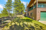 Nestled amidst lush greenery, this stunning property boasts a charming exterior with a blend of natural elements.