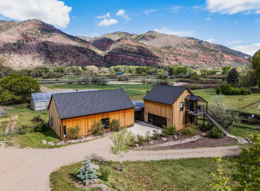 Discover your dream home nestled in the heart of nature! This stunning property boasts a modern design with beautiful wooden exteriors, offering a warm and inviting atmosphere.