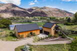 Discover your dream home nestled in the heart of nature! This stunning property boasts a modern design with beautiful wooden exteriors, offering a warm and inviting atmosphere.