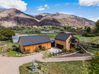 Discover your dream home nestled in the heart of nature! This stunning property boasts a modern design with beautiful wooden exteriors, offering a warm and inviting atmosphere.