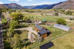 Discover your dream home nestled in a picturesque landscape! This stunning property boasts a modern farmhouse with ample space and privacy.