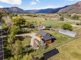 Discover your dream home nestled in a picturesque landscape! This stunning property boasts a modern farmhouse with ample space and privacy.