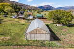 Discover a stunning property with a spacious greenhouse, perfect for cultivating your own garden.