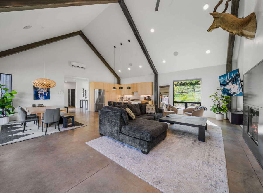 Experience luxury living in this stunning property featuring a spacious open floor plan and high ceilings.