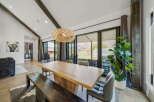 Experience luxury living in this stunning property, featuring a spacious dining area perfect for entertaining.