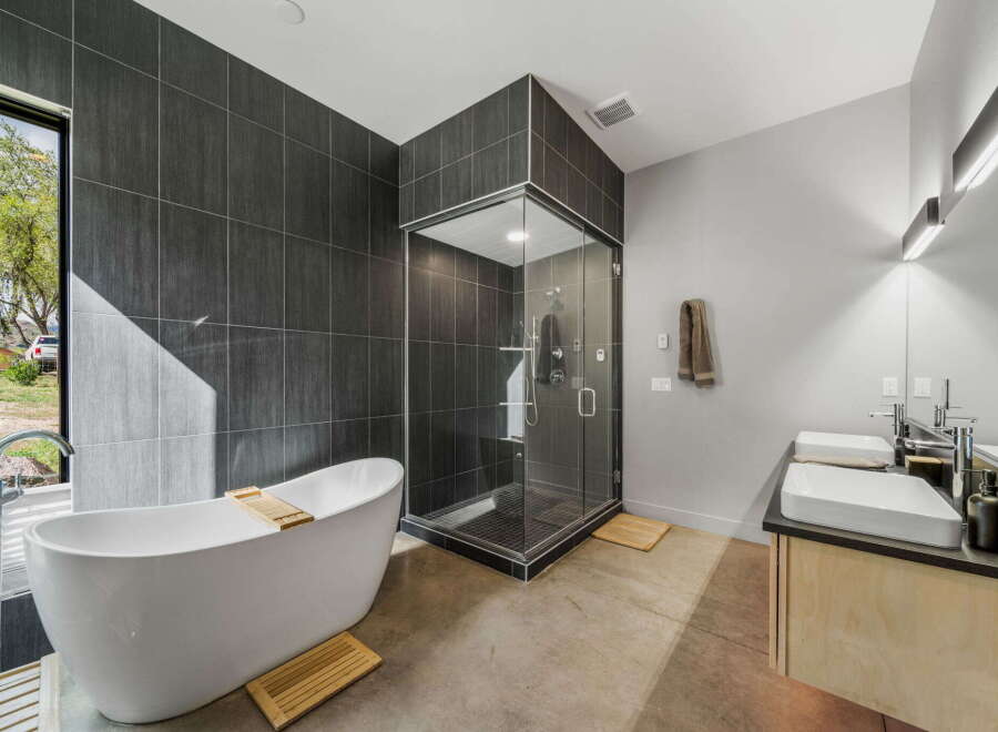 Step into luxury with this stunning bathroom featuring a sleek, modern design.