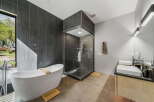 Step into luxury with this stunning bathroom featuring a sleek, modern design.