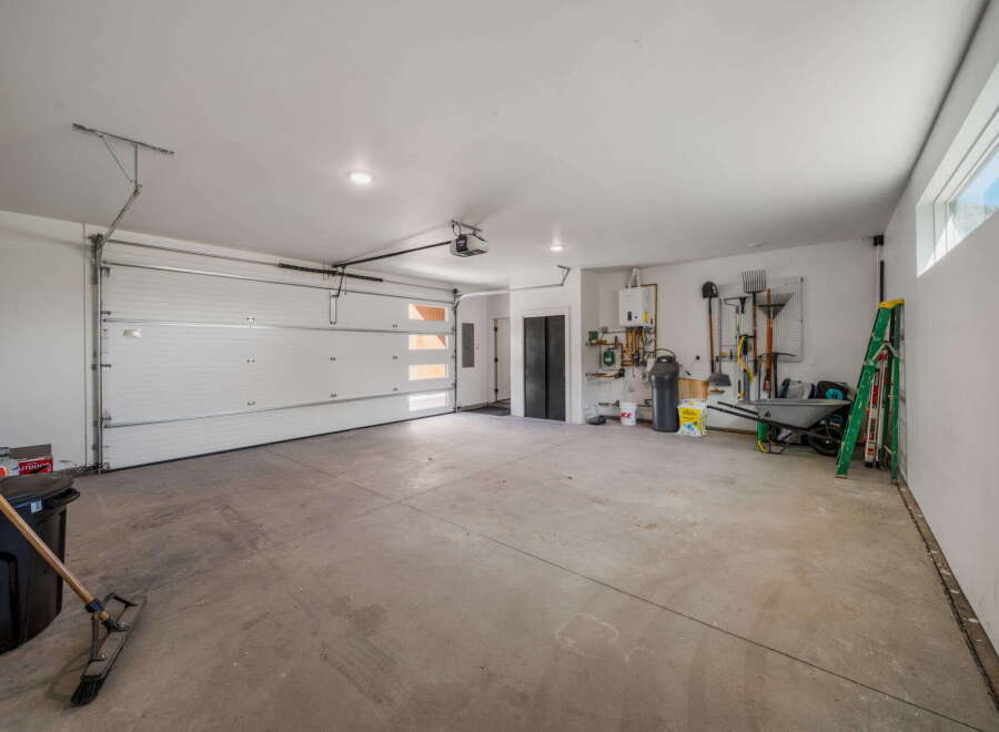 This spacious garage offers ample room for vehicles and storage.