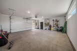 This spacious garage offers ample room for vehicles and storage.