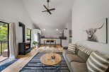Experience cozy living in this charming home featuring a modern fireplace and a stylish kitchen.