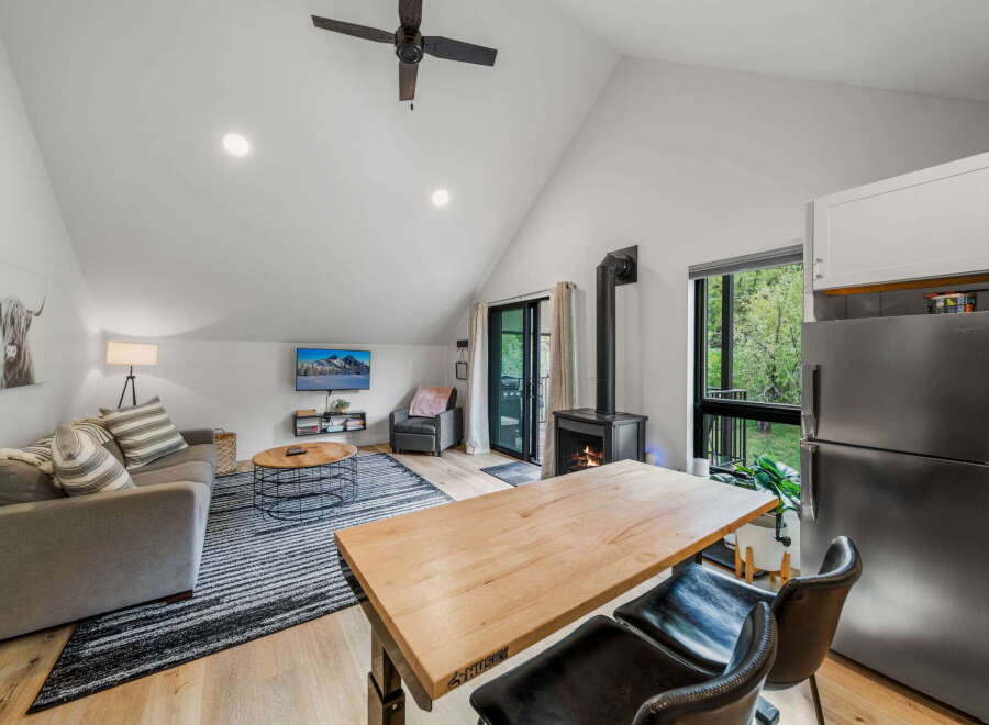 Discover modern living in this stunning property! Featuring a cozy living area with a fireplace and a sleek kitchen, this home is perfect for both relaxation and entertaining.