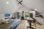 This stunning property boasts a modern open-concept living space with a cozy fireplace, perfect for relaxing evenings.