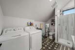 This stunning property boasts a modern laundry room and bathroom combination, perfect for maximizing space and functionality.