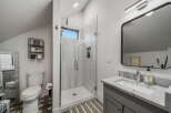 Step into this beautifully designed bathroom featuring a modern glass shower and stylish vanity.