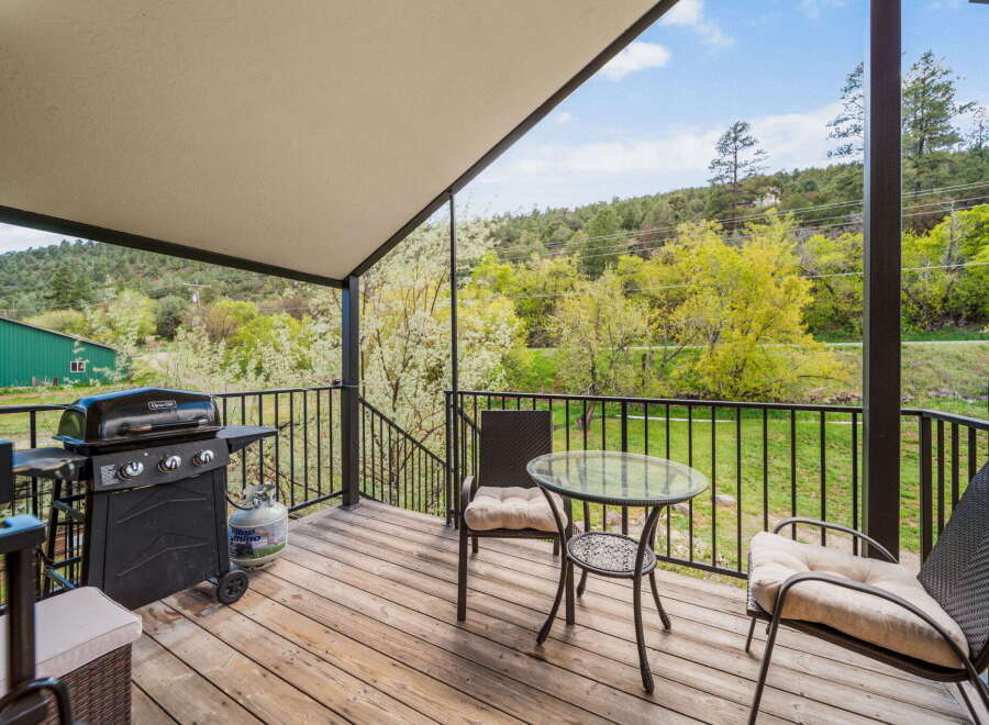Enjoy the tranquility of this stunning outdoor space! This property features a spacious deck, perfect for entertaining or relaxing.
