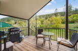 Enjoy the tranquility of this stunning outdoor space! This property features a spacious deck, perfect for entertaining or relaxing.