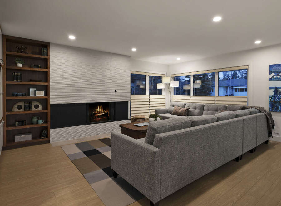 This stunning living room boasts a modern design with a cozy fireplace, perfect for relaxing evenings.