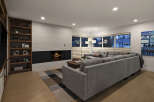 This stunning living room boasts a modern design with a cozy fireplace, perfect for relaxing evenings.