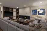 This stunning living room boasts a modern design with a cozy fireplace, perfect for relaxing evenings.