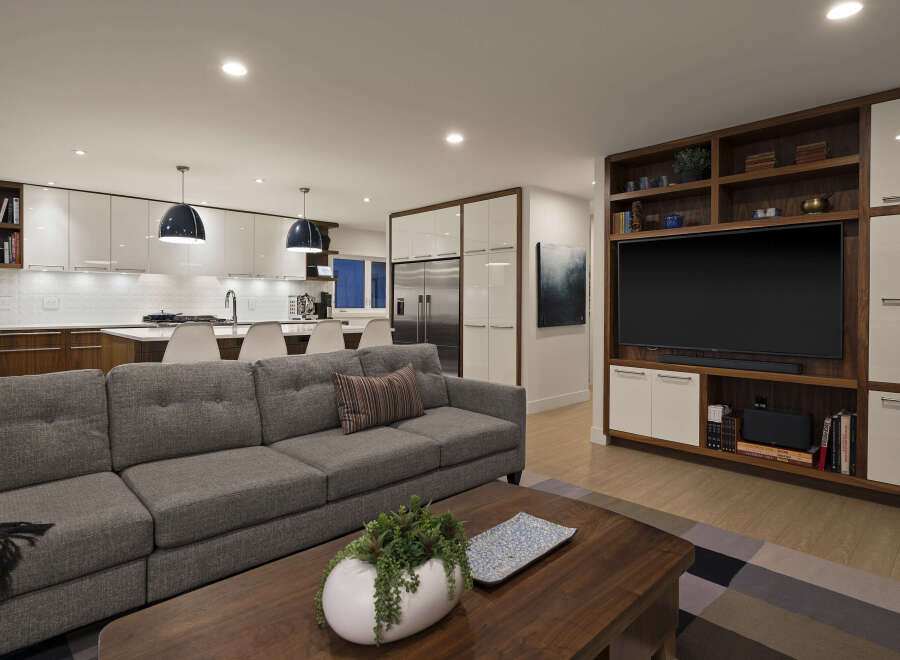 This stunning modern home features an open-concept living space with a gourmet kitchen and a cozy living area.