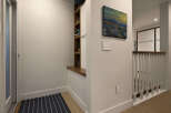 This stunning property features a modern entryway with a built-in shoe storage unit, perfect for keeping your space organized.