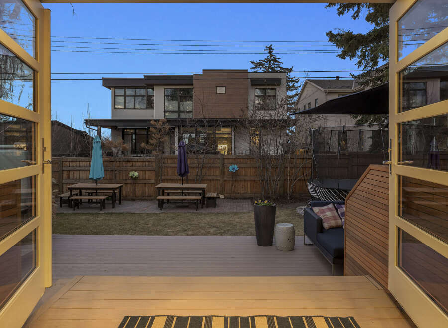 Step into luxury with this stunning property, showcasing a beautifully designed outdoor space perfect for entertaining.