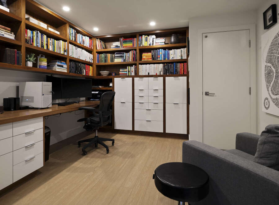 This stunning home office boasts custom built-in bookshelves, providing ample storage for books and decor.