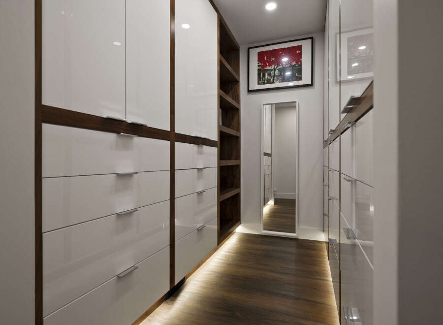 Step into luxury with this stunning walk-in closet, designed for both style and functionality.