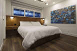 This stunning bedroom boasts a modern design with a touch of elegance.
