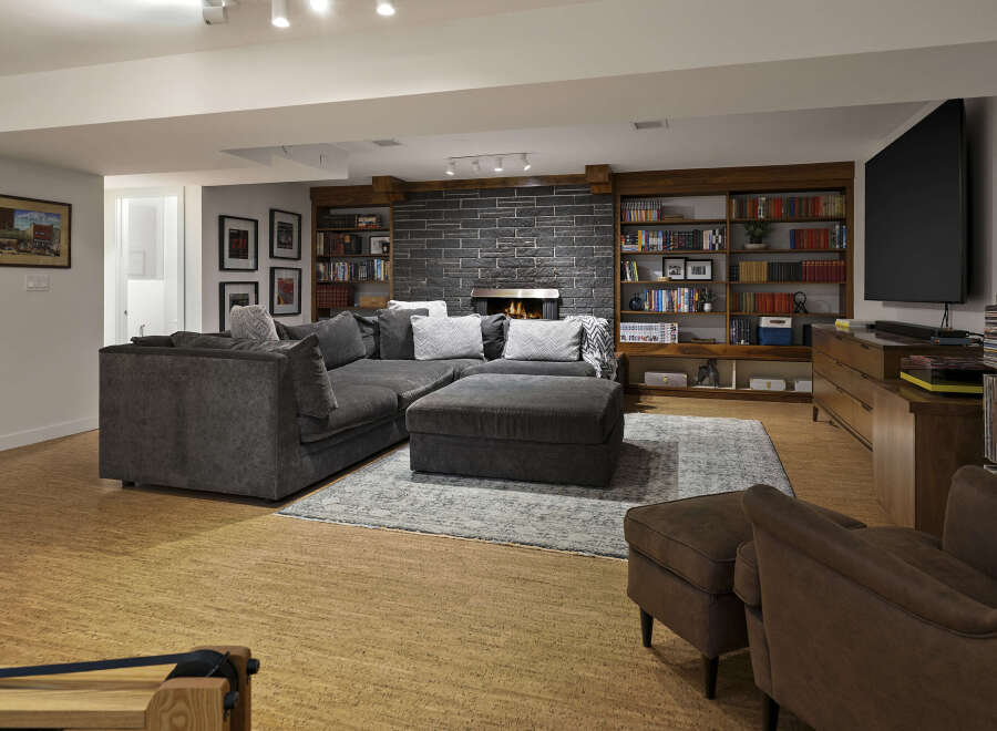 This stunning living space boasts a cozy sectional sofa, perfect for relaxing and entertaining.
