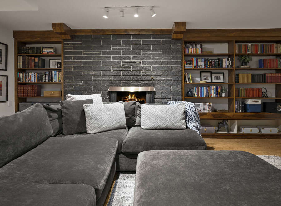 This stunning living room boasts a cozy fireplace, perfect for chilly evenings.