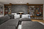 This stunning living room boasts a cozy fireplace, perfect for chilly evenings.