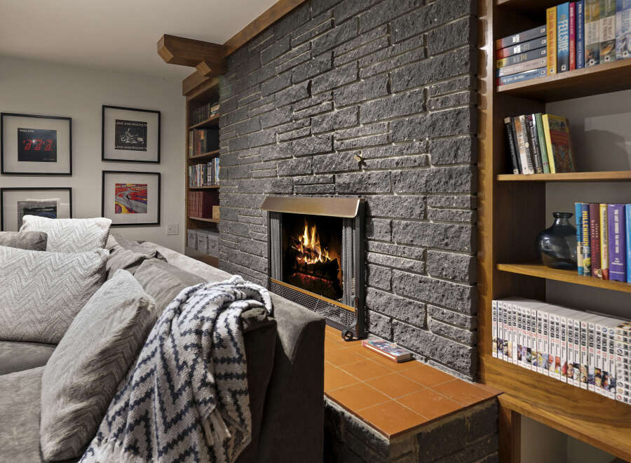 This cozy living space features a stunning stone fireplace, perfect for creating a warm and inviting atmosphere.