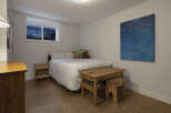 This cozy bedroom features a comfortable bed, perfect for a relaxing night's sleep.